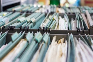 Shred these files to keep in compliance with information security laws.